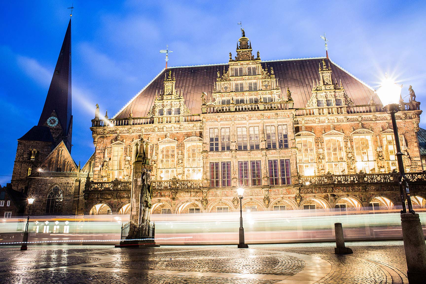 The precious city hall of Bremen by night with many lights