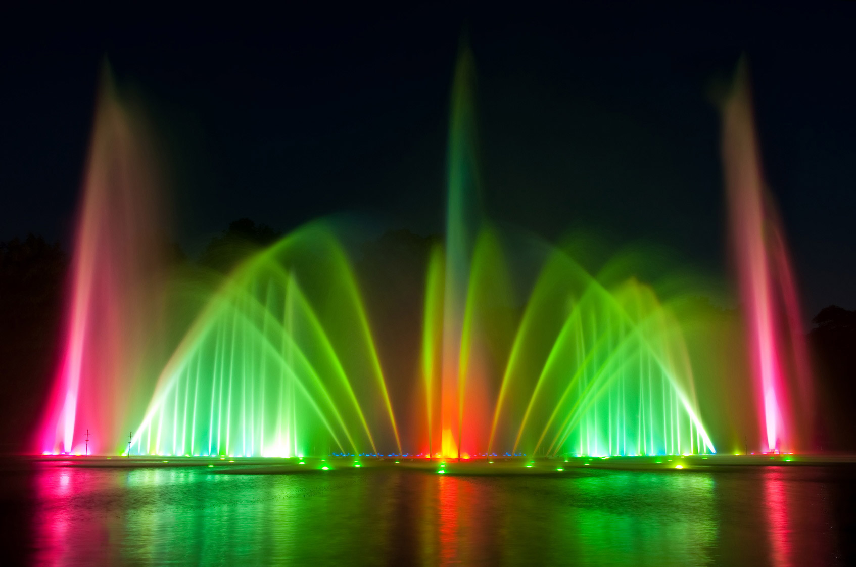 Light Show over the water with green and red lights