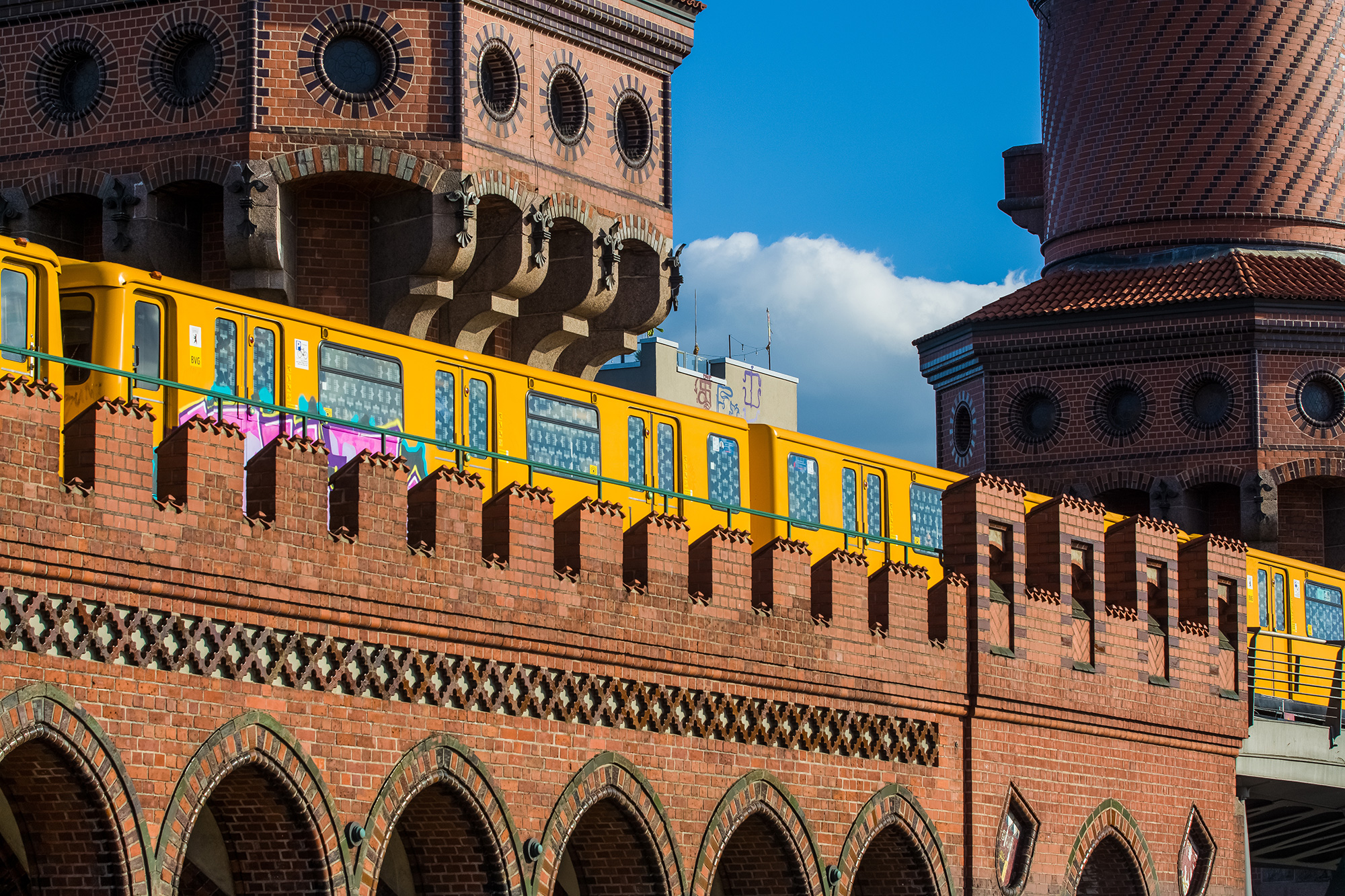 The yellow urban railway is passing through Berlin-City
